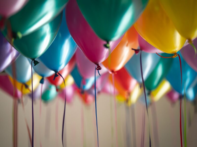 selective focus photography of assorted-color balloons